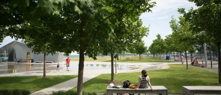 Flat paths, lawn and seating at Sherbourne Common beside Lake Ontario