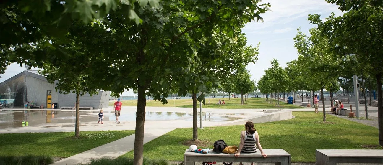Flat paths, lawn and seating at Sherbourne Common beside Lake Ontario