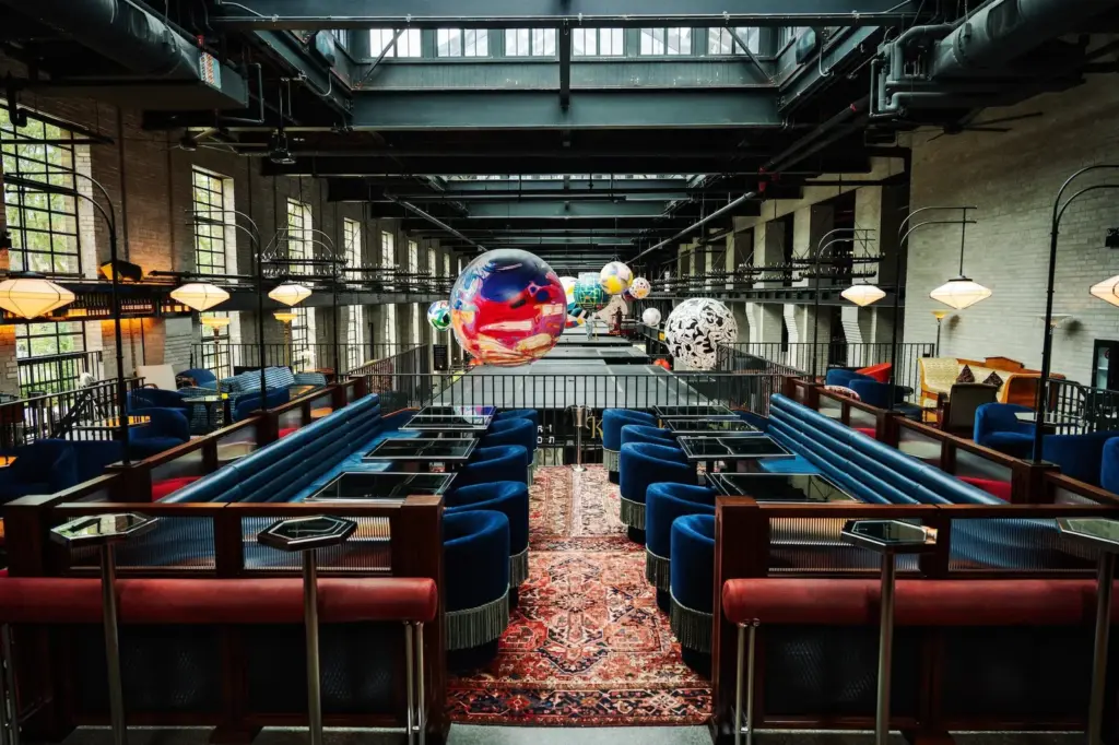Sofas, rugs and tables in a soft seating area at Waterworks Food Hall