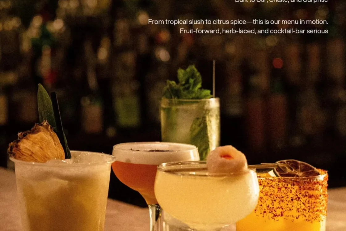 Several colourful cocktails sit on a table at Mahjong Bar.