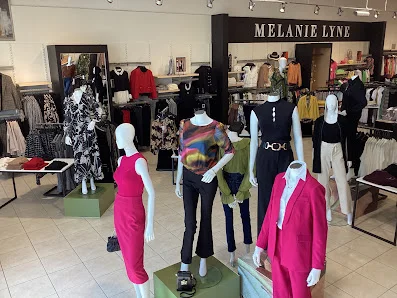 Dress displays inside Melanie Lyne in Woodbridge