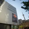 TIFF Lightbox exterior with the CN Tower visible behind it in downtown Toronto