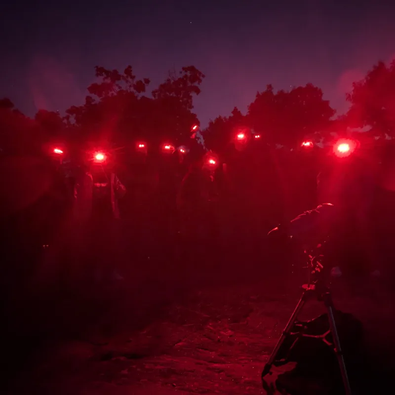 People using red lights around a telescope at Torrance Barrens
