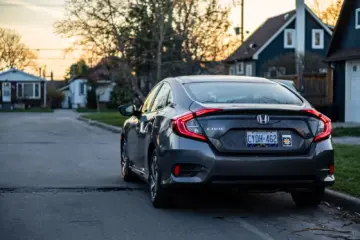 Honda Civic parked on a quiet Toronto residential street at sunset