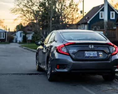 Honda Civic parked on a quiet Toronto residential street at sunset