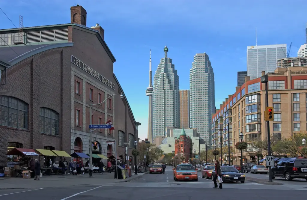 Cars, taxis and pedestrians on Front Street beside St. Lawrence Market