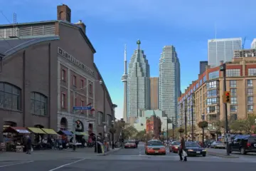 Cars, taxis and pedestrians on Front Street beside St. Lawrence Market
