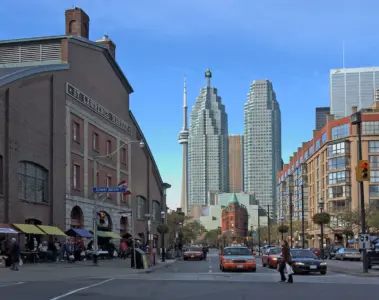 Cars, taxis and pedestrians on Front Street beside St. Lawrence Market