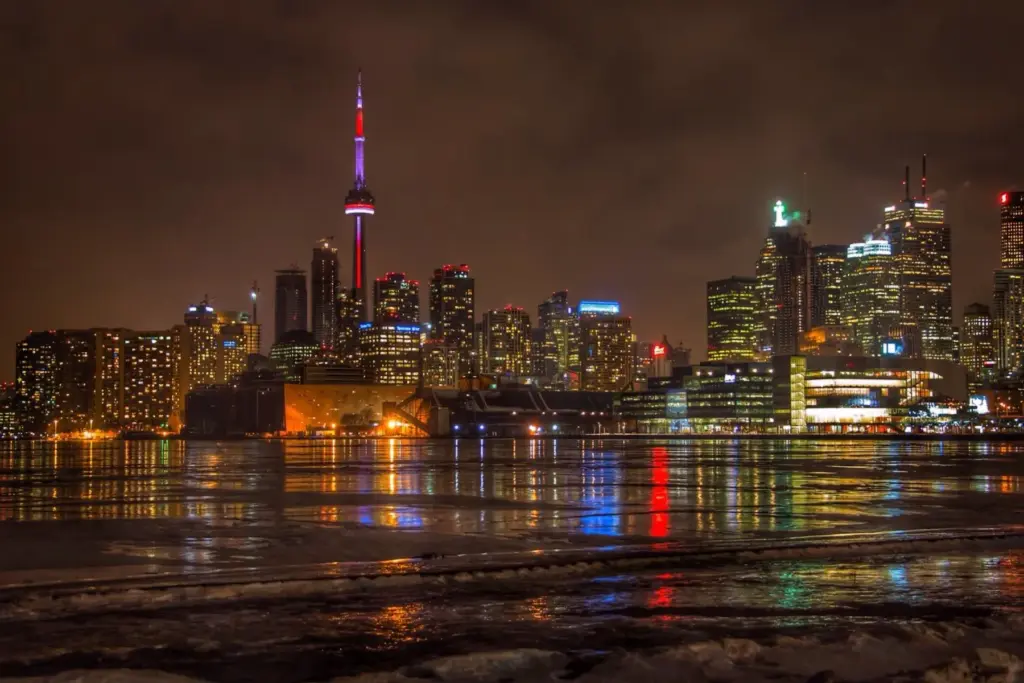 Toronto skyline and CN Tower reflected in the water at night