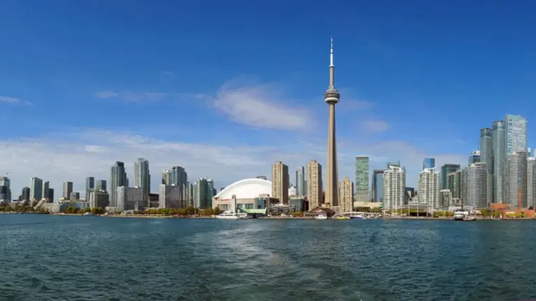 Wide daytime view of the Toronto skyline and CN Tower from Lake Ontario