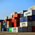 Rows of colourful shipping containers stacked at a freight terminal