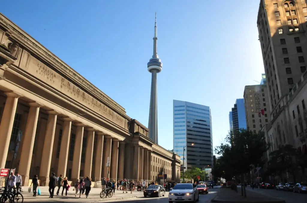 Union Station, the CN Tower, pedestrians, cyclists and traffic in downtown Toronto