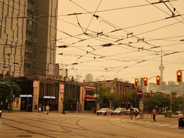 Orange wildfire haze over College Street and Spadina Avenue in Toronto