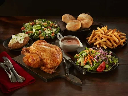Swiss Chalet Classic Family PAK with rotisserie chicken, four sides, rolls and dipping sauce