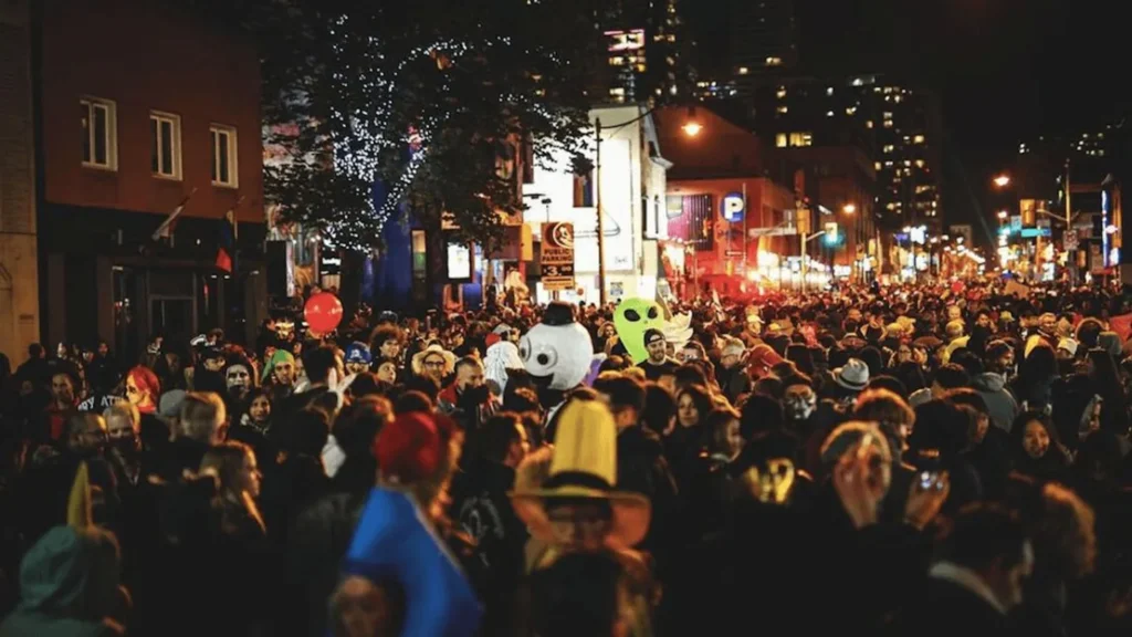 A large Halloween crowd on Church Street after dark