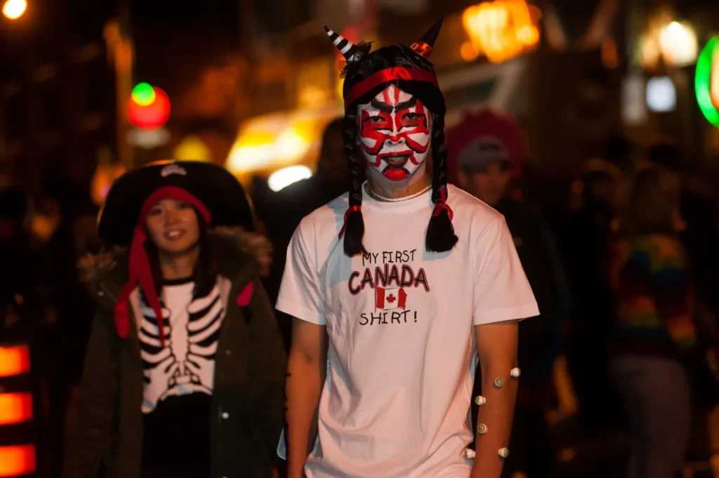 Visitors in face paint and costumes on Church Street