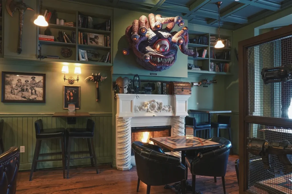 Themed dining room with monster decor and a fireplace at Storm Crow Manor