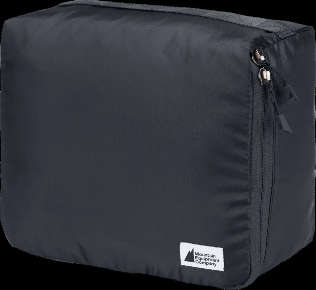 A zipped fabric packing cube for organising clothes