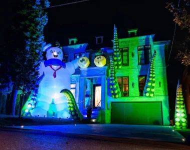 A Toronto house with green lighting, giant tentacles and a Stay Puft figure