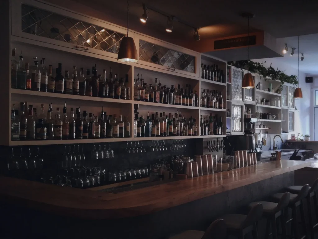 The bar counter and bottle shelves inside Grey Tiger