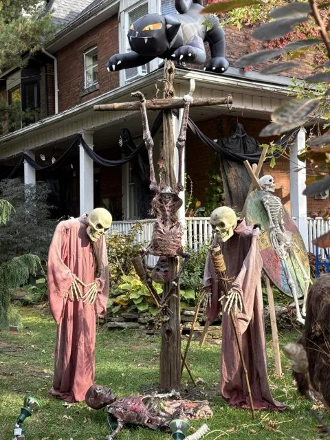 Skeletons and hanging Halloween decorations outside the Glenlake Avenue house