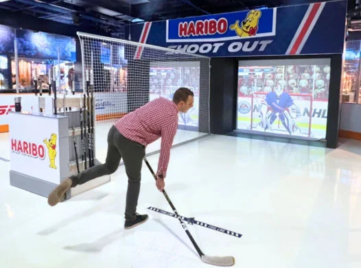 Visitor taking a shot in the Hockey Hall of Fame interactive rink