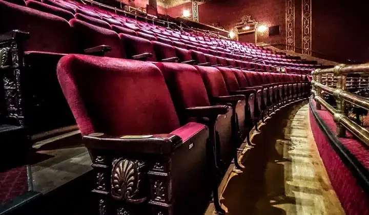 Rows of red seats inside the Elgin Theatre