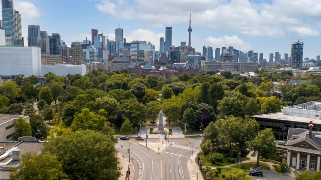 Aerial view of Queen’s Park with the Legislative Building and Toronto skyline