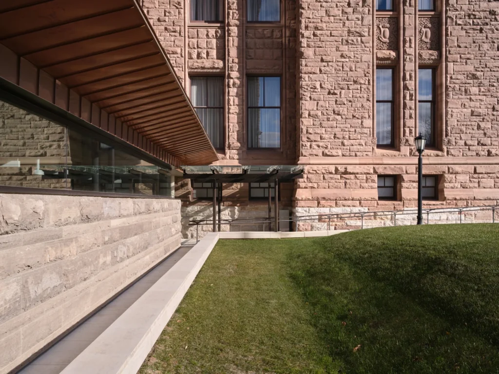 Ramp and sandstone walls at the Legislative Assembly’s Visitor Welcome Centre