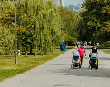 People walking on a paved path on Toronto Island