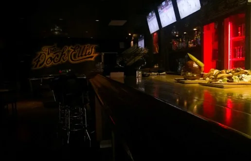 Televisions above the bar at The Dock Ellis on Dundas Street West