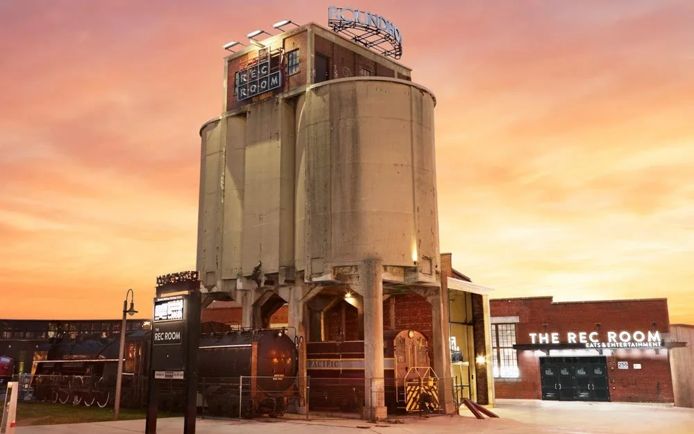 The industrial roundhouse exterior and entrance sign at The Rec Room Toronto