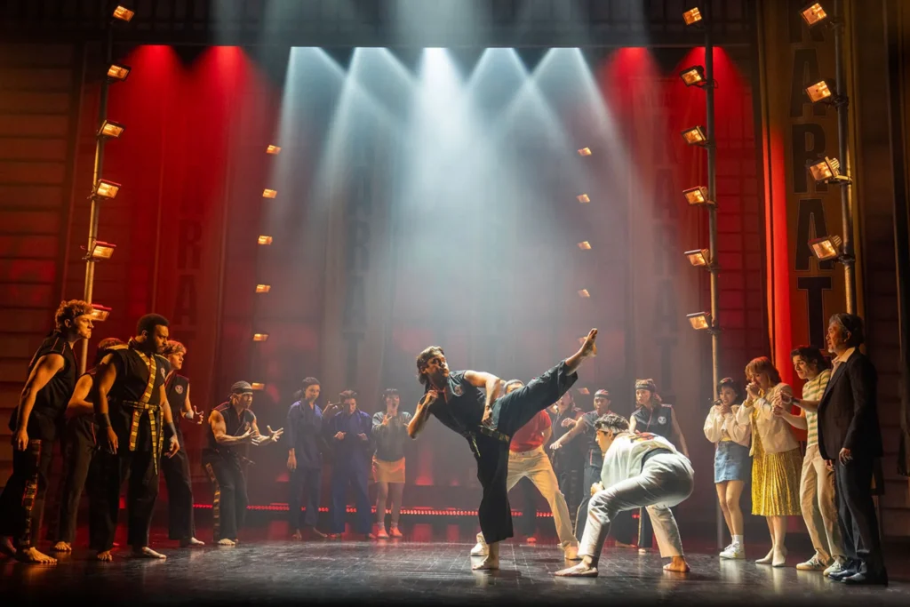 The cast of The Karate Kid musical performing a group stage scene