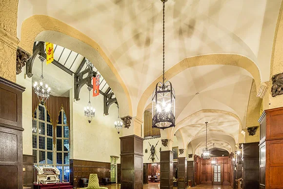 High stone arches and wooden panelling in Casa Loma’s Great Hall