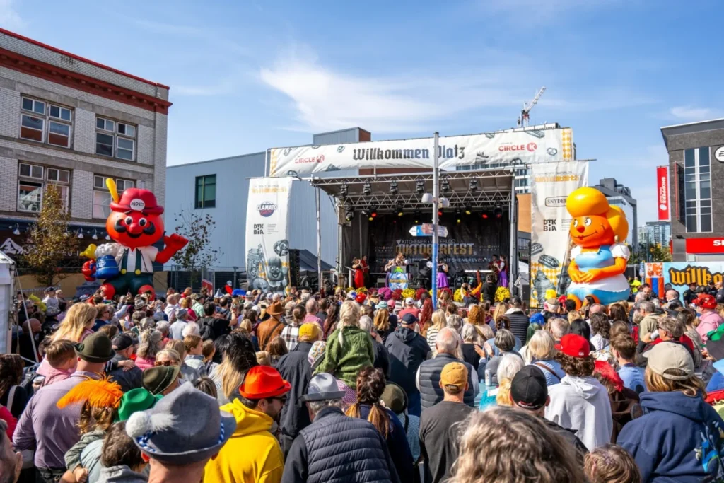 Festival visitors and performers at Willkommen Platz in Kitchener