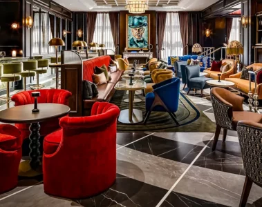 Red chairs and dark wood inside Library Bar at Fairmont Royal York