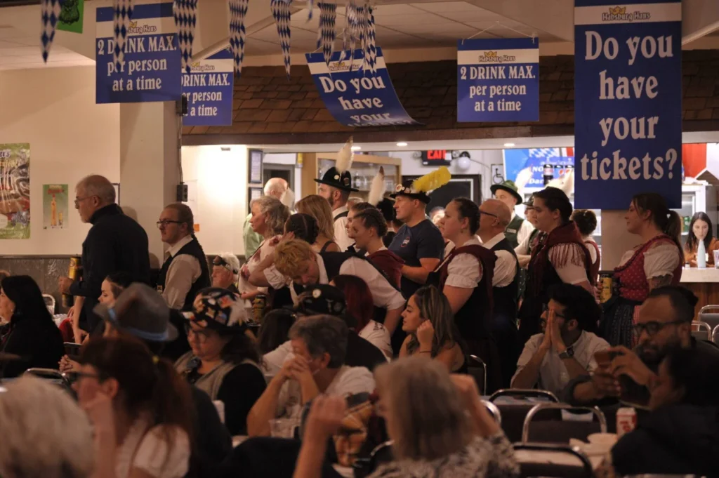 Guests seated at tables inside the Alpine Club