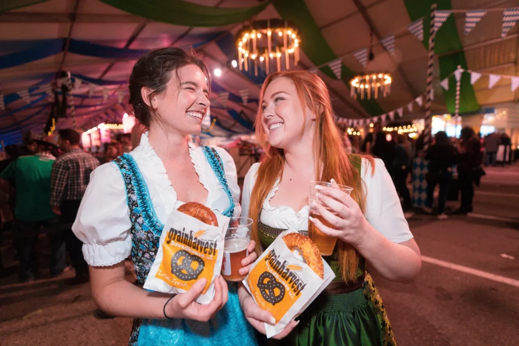 Two women holding steins at Toronto Oktoberfest