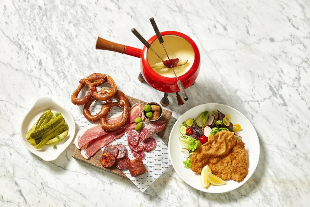 WVRST sausages, schnitzel, pretzels and charcuterie on a table