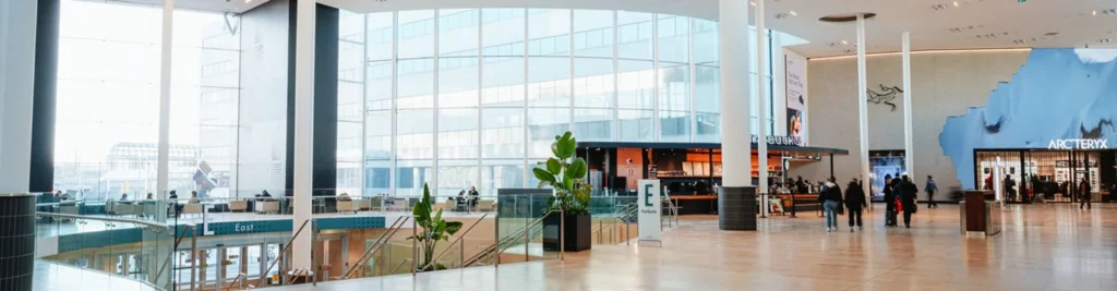 The bright interior of Yorkdale Shopping Centre with shops and seating