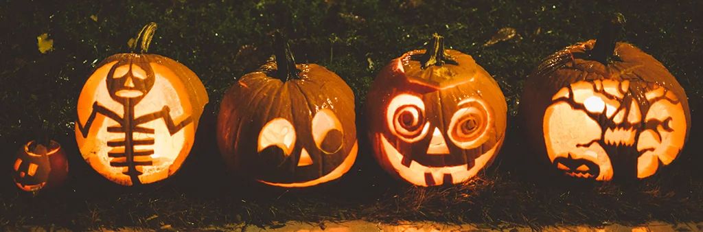 Four illuminated pumpkin carvings in a City of Toronto parade photograph