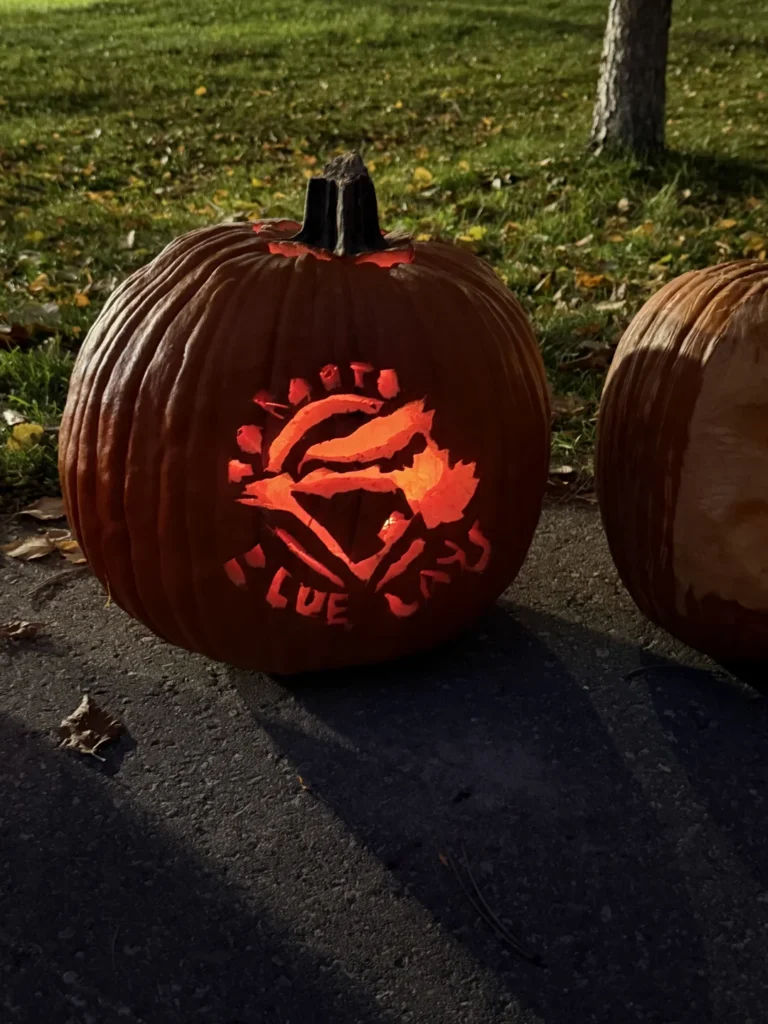 A pumpkin carved with a Toronto Blue Jays design