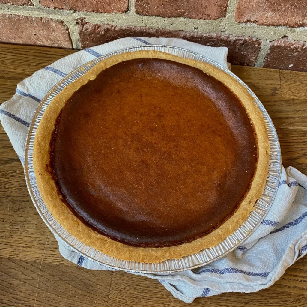 A whole pumpkin pie in a foil tray at Tre Mari