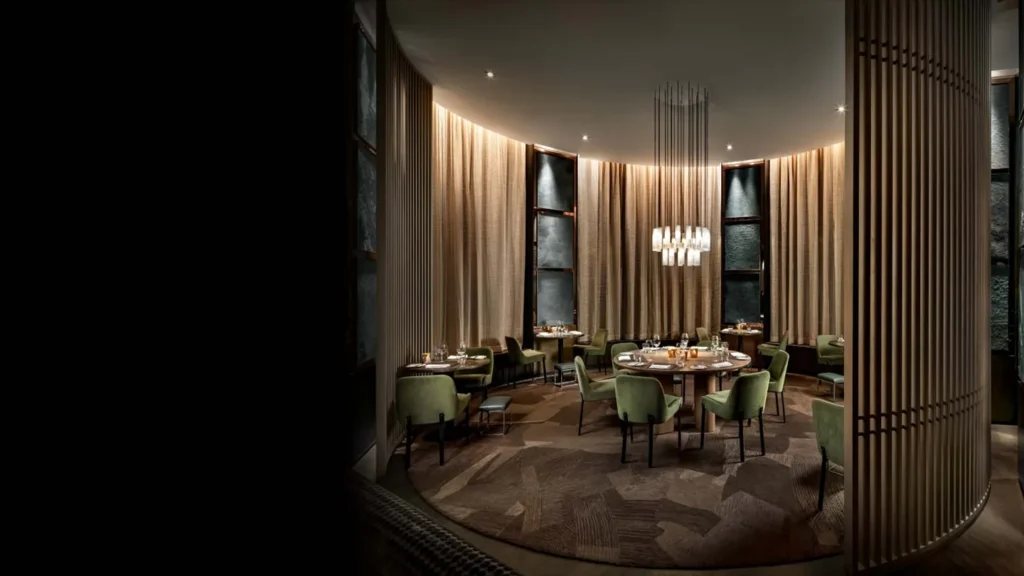 Tables and upholstered chairs inside ONE Restaurant
