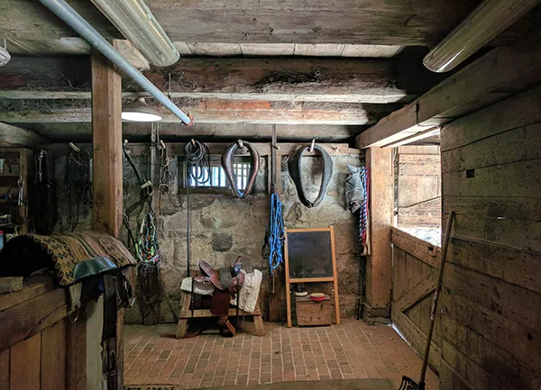 Tools and equipment inside a wooden barn at Riverdale Farm