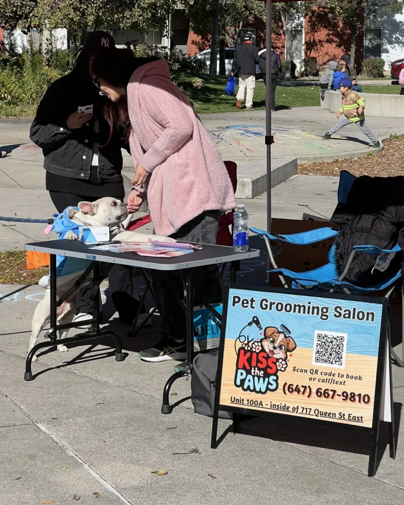 A visitor with a child at a stall during Riverside’s Halloween festival