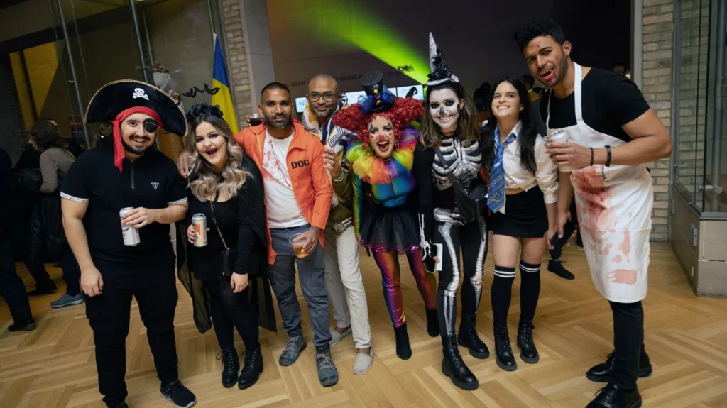 Costumed guests posing together at ROM After Dark
