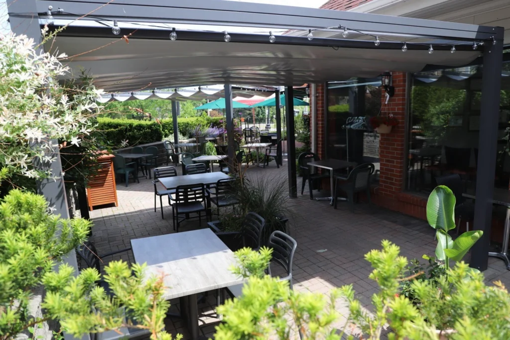 Tables under a covered patio at Apricot Tree Café