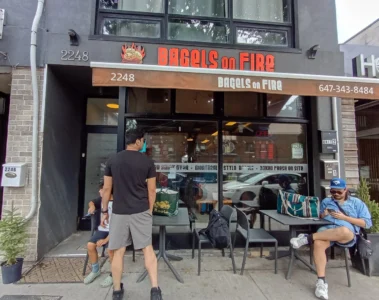 Customers outside Bagels on Fire at 2248 Queen Street East