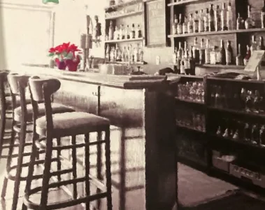 The bar and high stools inside The Beech Tree